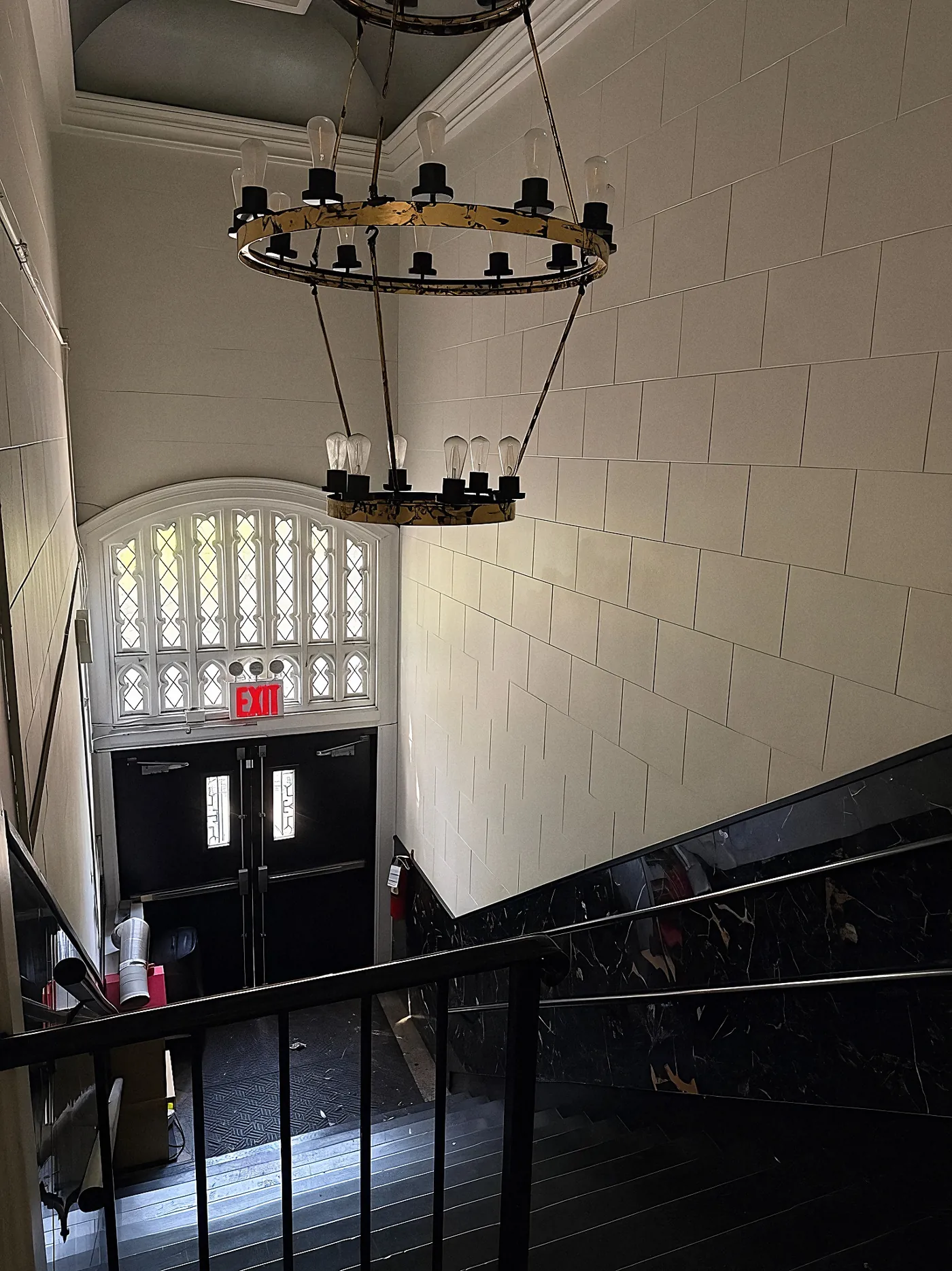 Light through the original leaded-glass window above the convent's entrance stair
